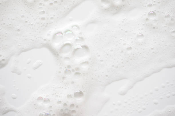 istock Abstract background white soapy foam texture. Shampoo foam with bubbles 1159612333