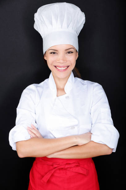 istock Asian female chef in chef whites uniform and hat 1159612885