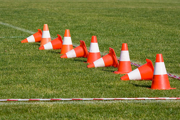 Line of orange and white cones stock photo