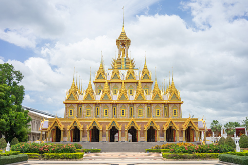 Golden Castle at Wat Chantharam (Wat Tha Sung) Uthaithani ,Thailand an old temple decorated with beautifully carved gold carvings