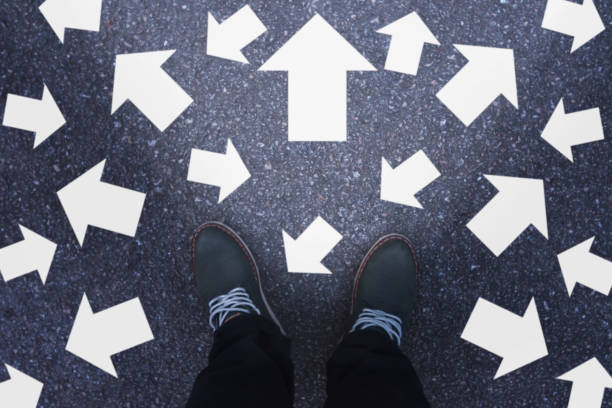 istock People standing with arrows concept decisions for the future with many direction arrow choices, left, right or move forward 1159615373