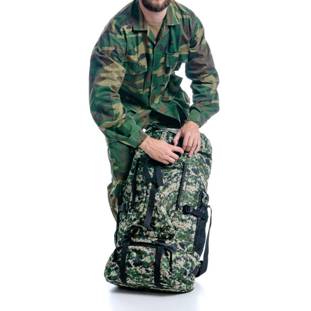 istock Man in military uniform, camouflage with backpack 1159615649