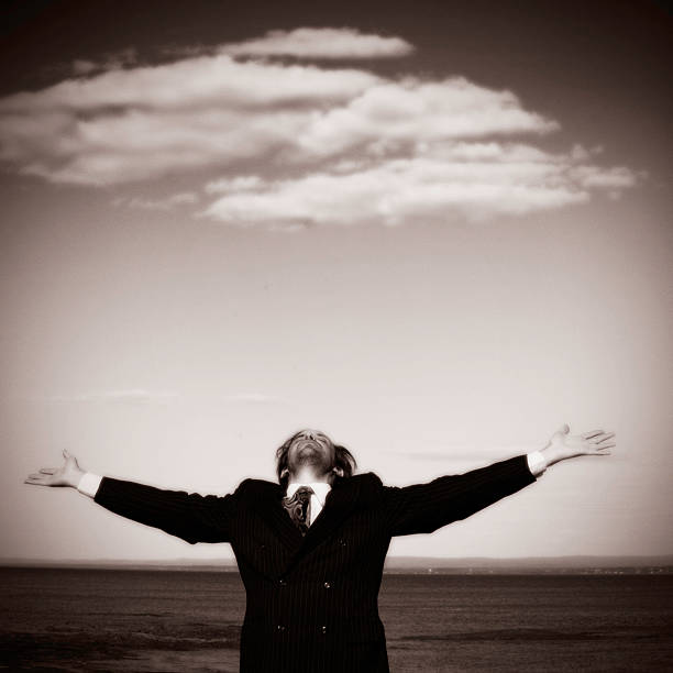 istock Businessman Holding Hands to Sky 115961622