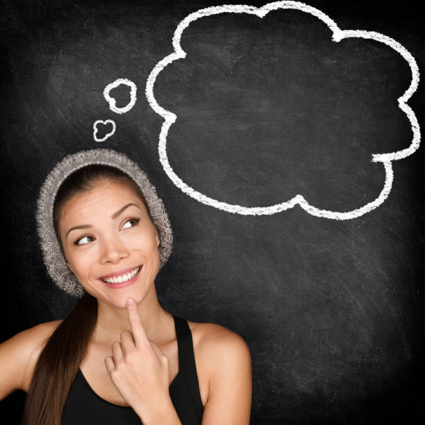 istock Thinking student hipster woman by blackboard 1159616719
