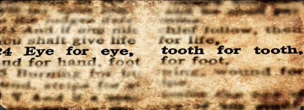Bible scripture eye for an eye and tooth for a tooth old testament verse stock photo
