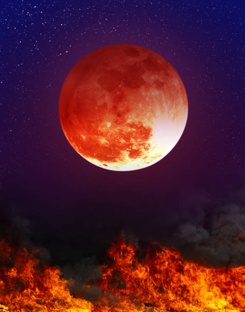 Landscape of night sky with super blood moon above the fire. Moon eclipse. Photo Manipulation. Colorful skyscape with many stars. Landscape of night sky with super blood moon above the fire. The moon were NOT furnished by NASA. red full moon stock pictures, royalty-free photos & images