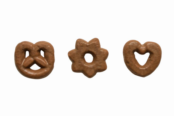 istock Chocolate glazed gingerbread cookies isolated on white background. 1159618555