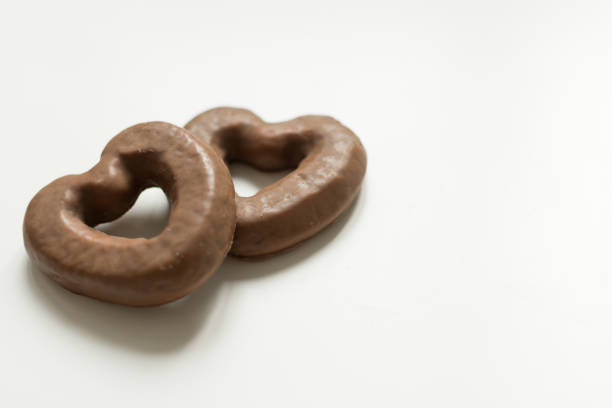 istock Chocolate glazed gingerbread cookies on white background. 1159618639