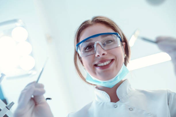 istock Cute Female Dentist Preparing To Start Surgery 1159621245