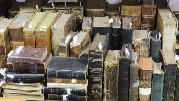 old bible books on a bookshelf from the 1800s - history library victorian style christianity imagens e fotografias de stock