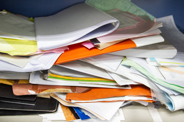 istock Messy file document and Office Supplies in filing cabinets at work office 1159622515