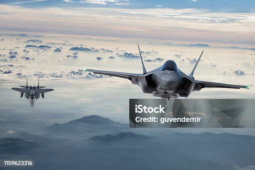 istock Fighter Jets flying at twilight 1159623316