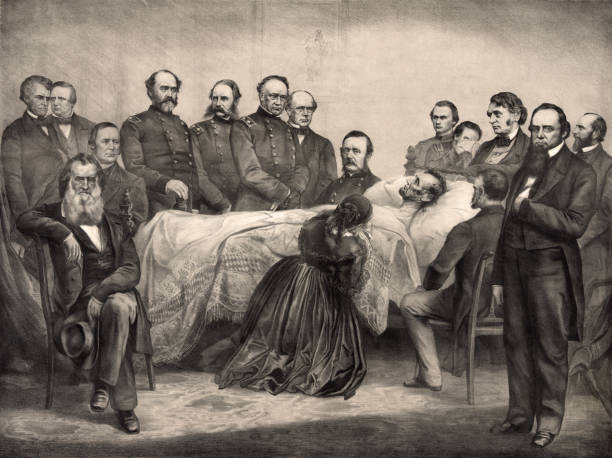 Abraham Lincoln on His Deathbed Surrounded by Mourners Vintage illustration features President Abraham Lincoln as he lay dying on his deathbed on April 15, 1865, the morning after he was shot in the head by a Confederate sympathizer while watching a play at Ford's Theatre in Washington, D.C. Lincoln died on April 15, 1865, at 7:22 am, aged 56. abraham lincoln stock illustrations