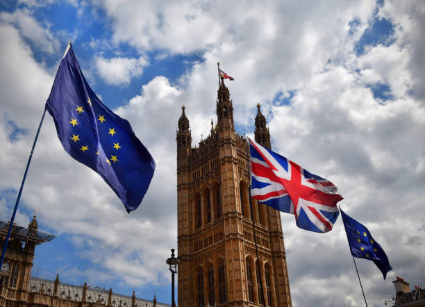 Brexit flags The European Union and UK flags flying outside tje House of Parliament in London as part of a Brexit protest inner london stock pictures, royalty-free photos & images