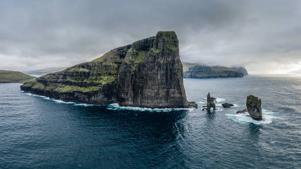 istock Risin og Kellingin (The Giant and the Witch) sea stacks rocks near Eidi 1159625640
