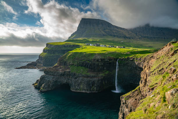 istock Mulafossur waterfall in Gasadalur at dusk, Vagar 1159625675