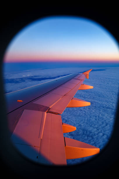istock Aerial view from airplane window at sunset 1159625735