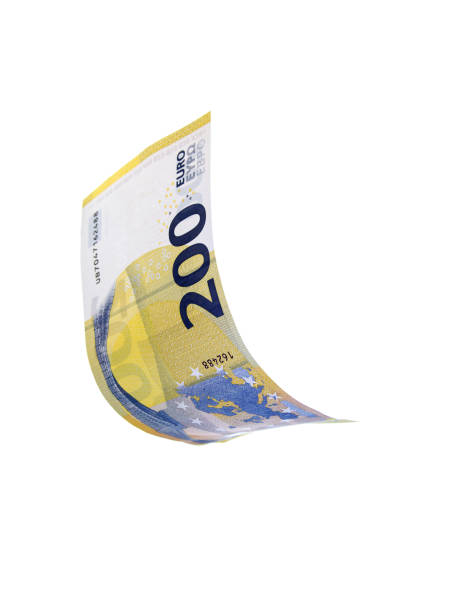 летающие евро деньги к сведению на белом фоне - euro paper currency стоковые фото и изображения