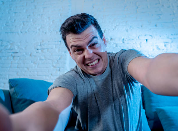istock Portrait of young student man playing video games having fun winning the game using wireless remote joystick with freak intense happy face in Male game addiction to console play station and video. 1159627351