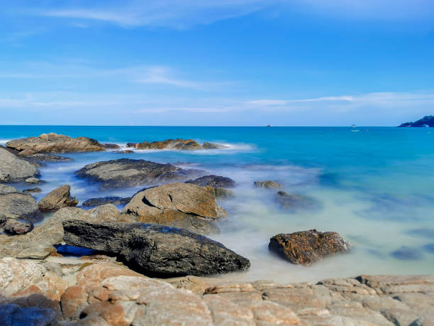 istock Rocks on the beach, Landscape with blue sea and Blue sky 1159627557