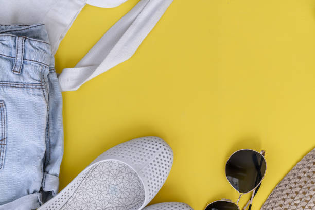 istock Summer travel accessories  on yellow background, flat lay, top view 1159627866