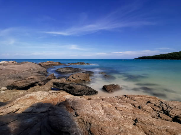 istock Rocks on the beach, Landscape with blue sea and Blue sky 1159628031