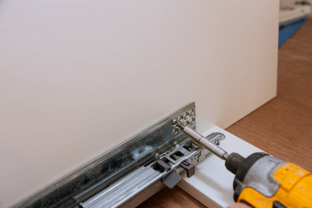 istock Mounting hinges for furniture accessories used when assembling kitchen furniture 1159630601