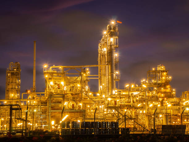 istock Oil and gas refinery plant with sunset. 1159634572