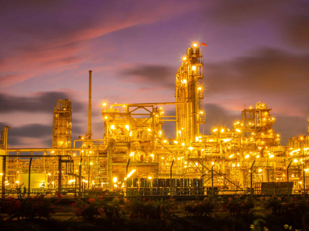 istock Oil and gas refinery plant with sunset. 1159634601
