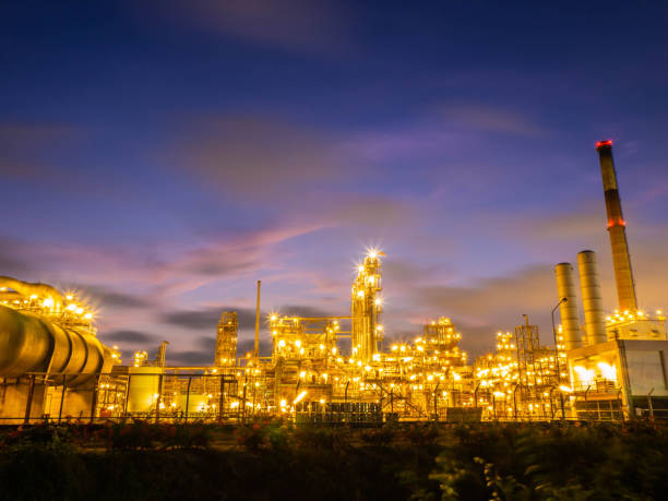 istock Oil and gas refinery plant with sunset. 1159634664