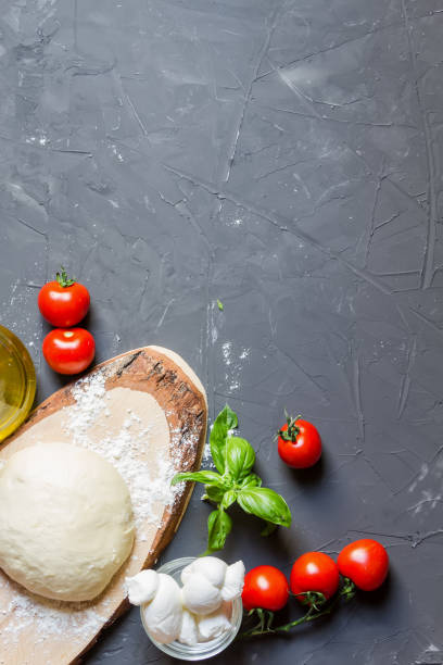 istock Pizza ingredients on the grey background with copy space, vertical photo, you can put your image or inscription 1159635538