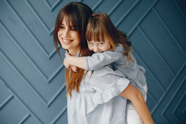 istock Mother with little daughter in a room 1159637326