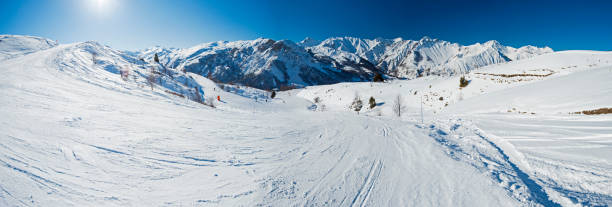 istock View down a piste in alpine ski resort 1159638188