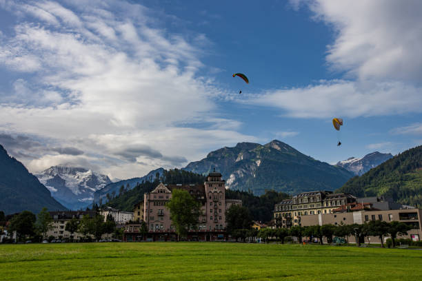 Beautiful landscape of Interlaken downtown with jungfrau peak behide, Switzerland Beautiful landscape of Interlaken downtown with jungfrau peak behide, Switzerland. jungfrau stock pictures, royalty-free photos & images