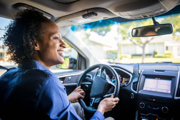 Young Black Woman Driving Car for Rideshare stock photo