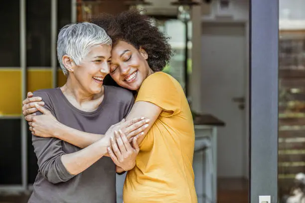 Photo of Two beautiful woman embracing