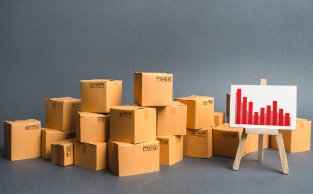 istock A big pile of cardboard boxes and a stand with information chart. Increasing consumer demand, exports or imports. rate growth of production of goods and products, increasing economic indicators. 1159638753