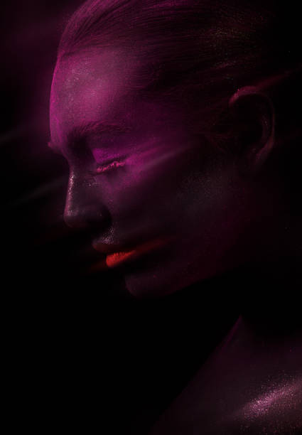 istock Model with purple face and red lips 1159640356