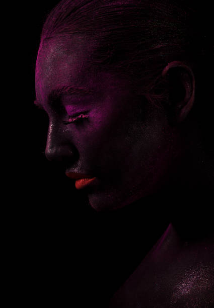istock Model with purple face and red lips 1159640359