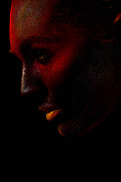 istock Profile of woman with painted face 1159640407