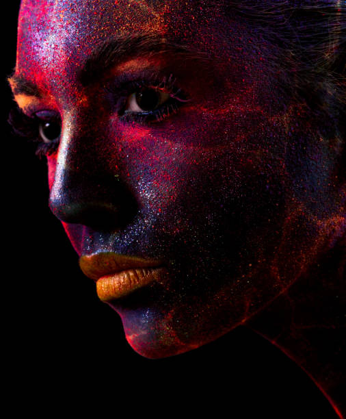 istock Sensual woman with dark glittering face 1159640413