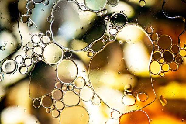 istock Black and gold abstract pattern made with oil bubbles on water 1159641311