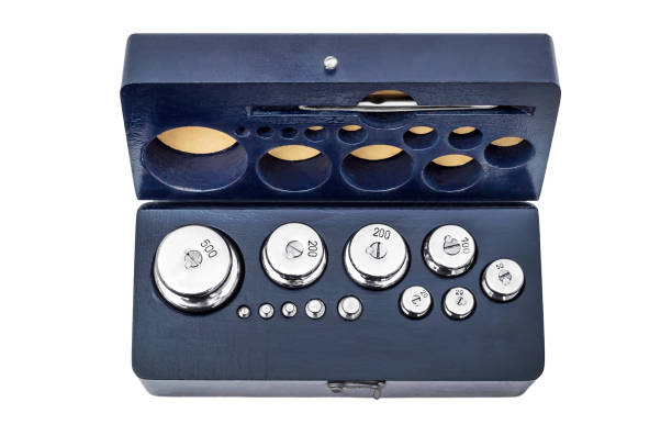 istock Set of weights for laboratory scales in box. Isolated on white. 1159641472