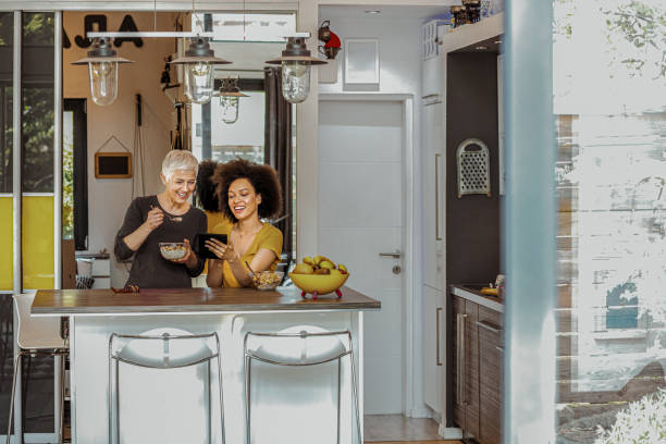 istock Two women making cereals for breakfast 1159642622