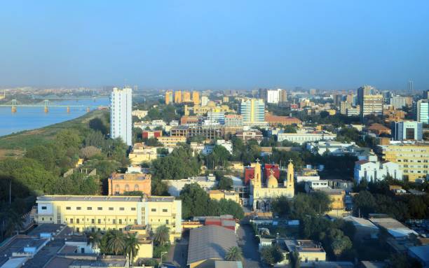 Khartoum downtown skyline - Blue Nile waterfront, Sudan Khartoum, Sudan: skyline of the Sudanese capital - downtown area, waterfront along the Blue Nile river, government buildings, presidential palace, churches... and North Karthoum. blue nile stock pictures, royalty-free photos & images