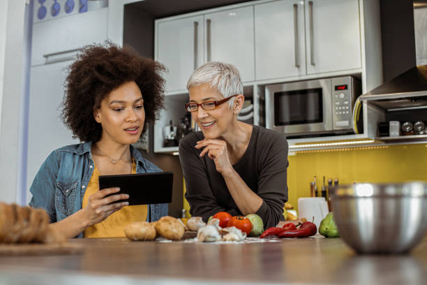 istock Two woman preparing lunch 1159642767