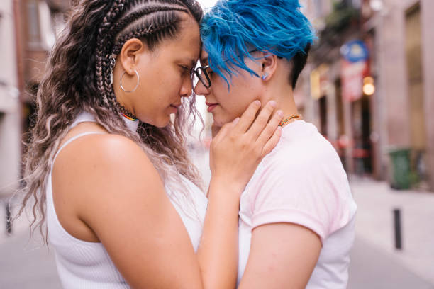 istock Tender kiss between same sex couple. 1159643053