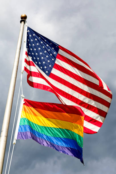 istock American Flag and LGBT flying together 1159643512