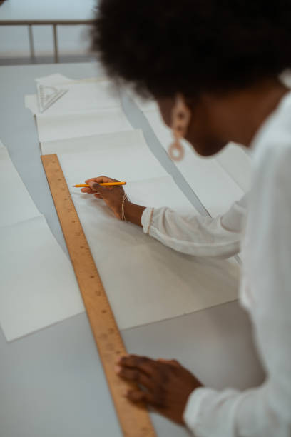 istock African American female designer creating a sewing pattern 1159644644
