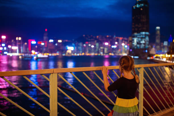 istock Kids watch Hong Kong harbor skyline. 1159646581